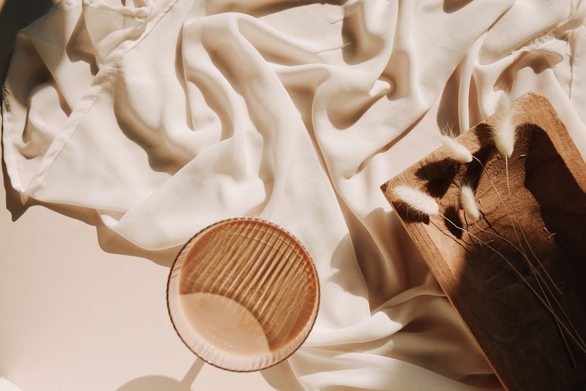 Brown Glass on White Cloth